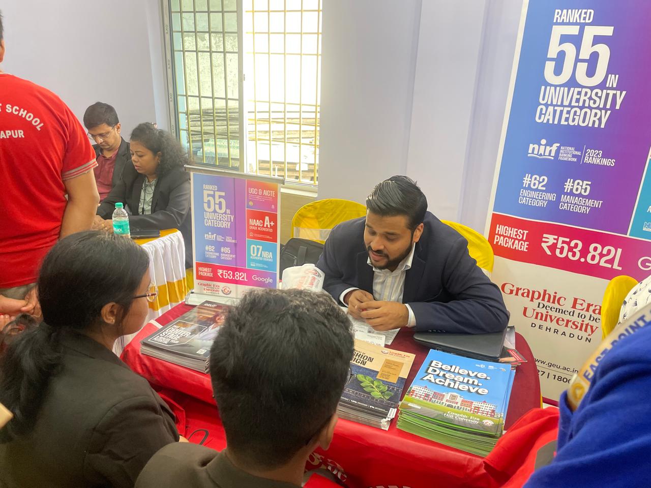 Mentor reviewing programs with a prospective student