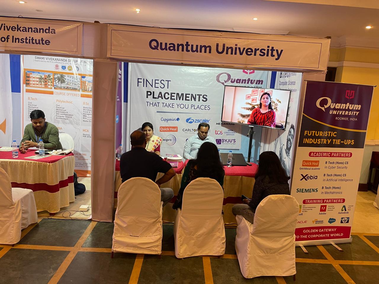 Counselor guiding students through course brochures