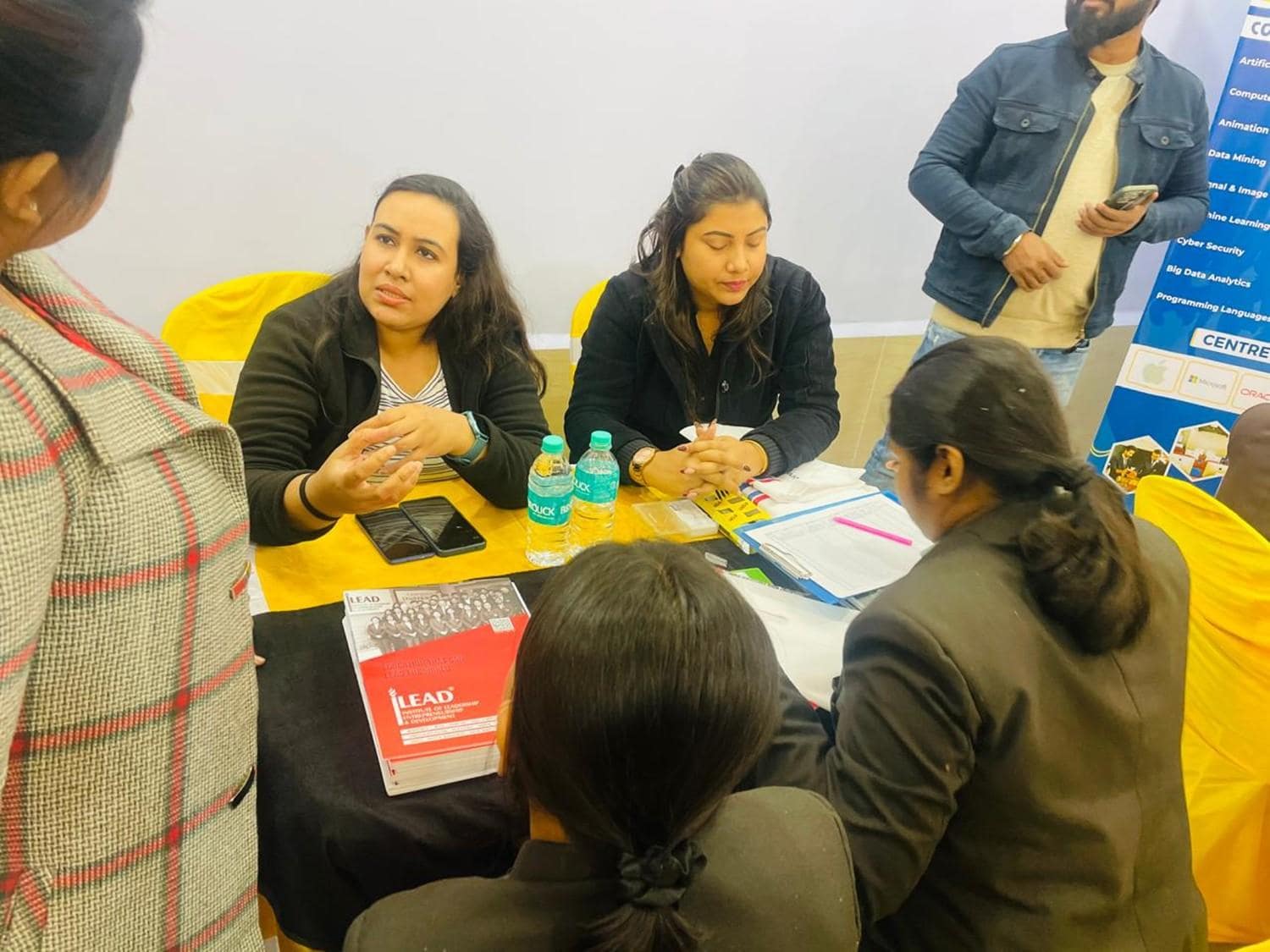 Mentor reviewing programs with a prospective student