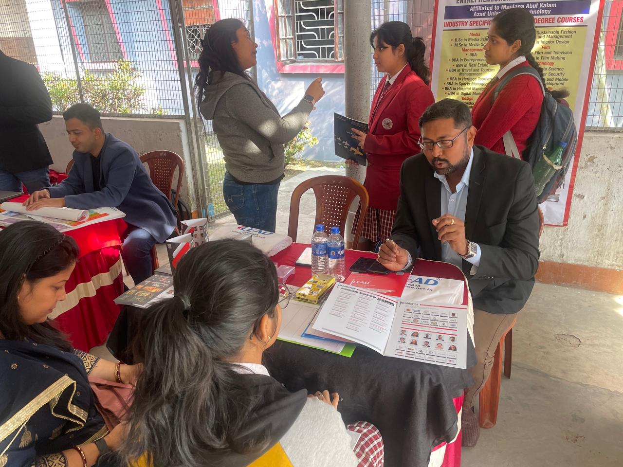 Mentor reviewing programs with a prospective student