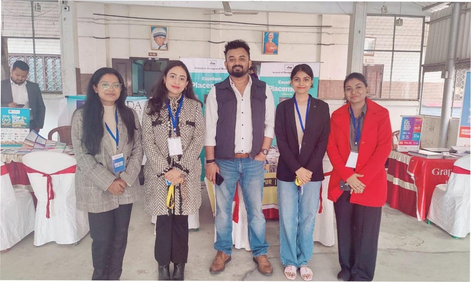 Counselor guiding students through course brochures